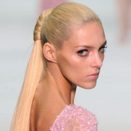 blonde elie saab model with her hair in a structured twisted ponytail