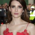 emma roberts with chocolate brown hair wearing red dress at met gala event