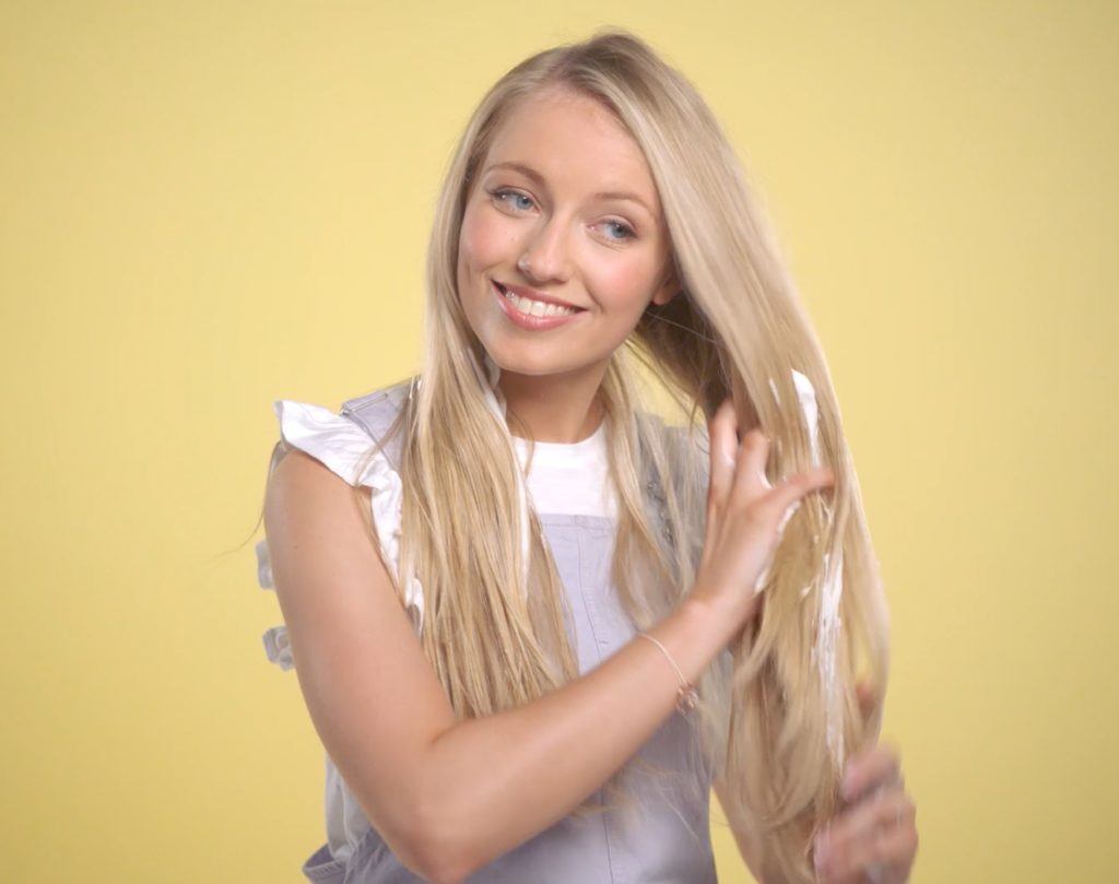 youtube beauty vlogger freddy my love applying mousse to her lengths