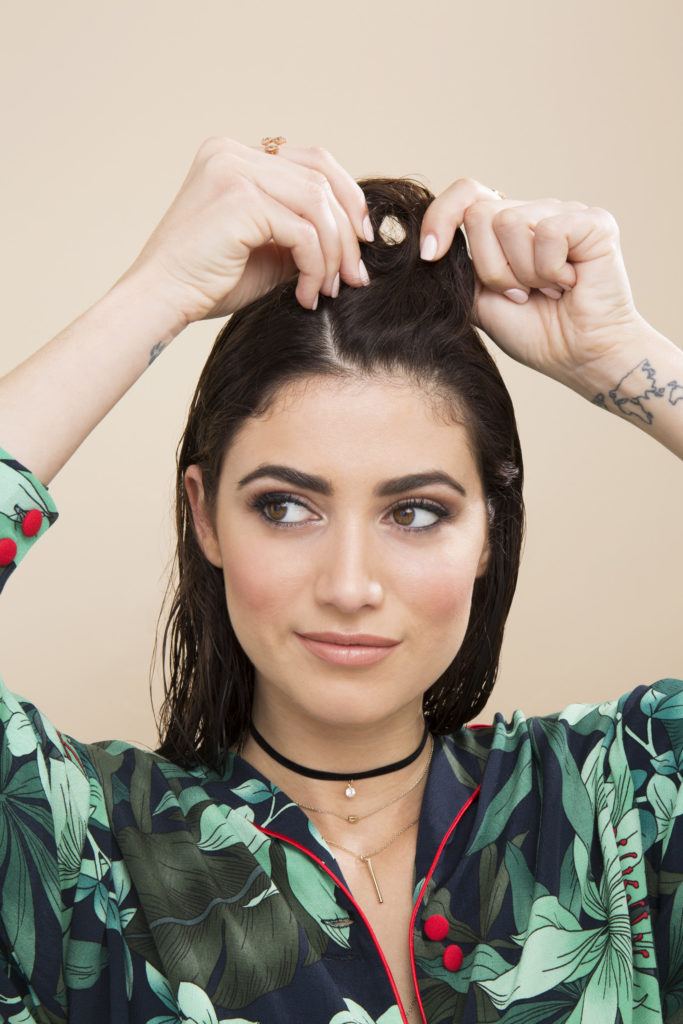 Pin curls tutorial: Brunette model creating her first pin curl