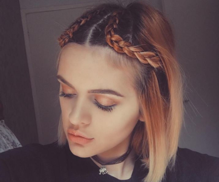Orange to blonde balayage straight bob with two cornrow braids going down the centre forward