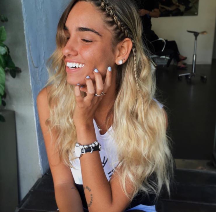 Long blonde beach waves hair with single braid from centre down to ear