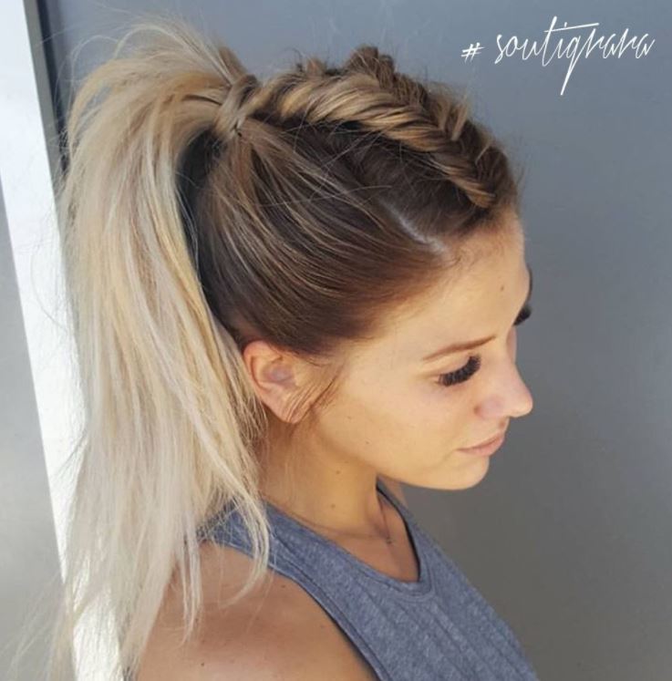 Brown to blonde ombre long hair in high ponytail with fishtail braid down the centre.