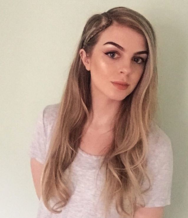 Long dirty blonde hair in side parting with single braid on the side.