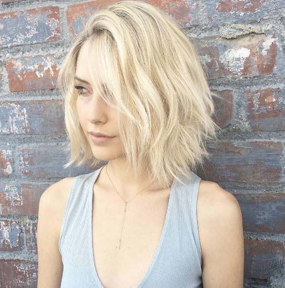 Face shapes - light blonde angular lob in side part with beach waves