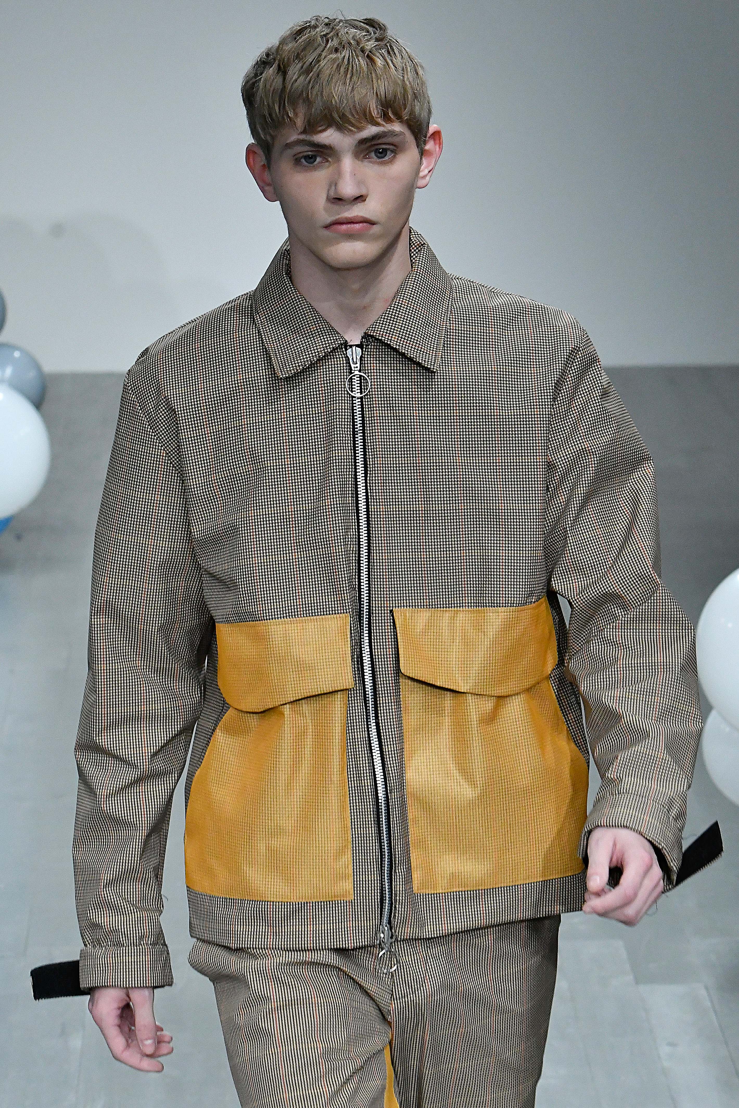 blonde male model at the what we wear lfwm show with a textured modern fringe cut