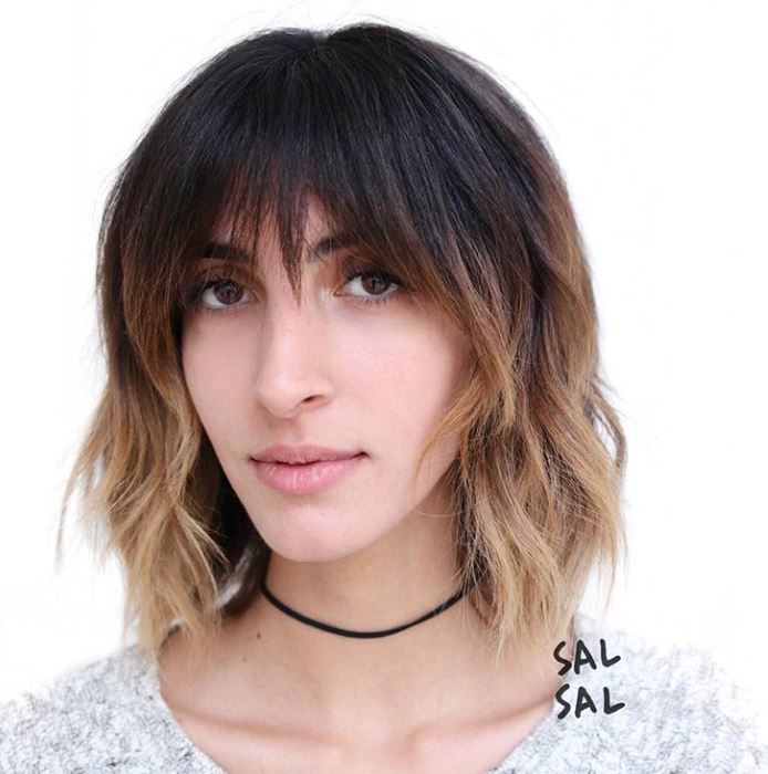 Short ombre hair: Woman with shag haircut with ombre hair colour.