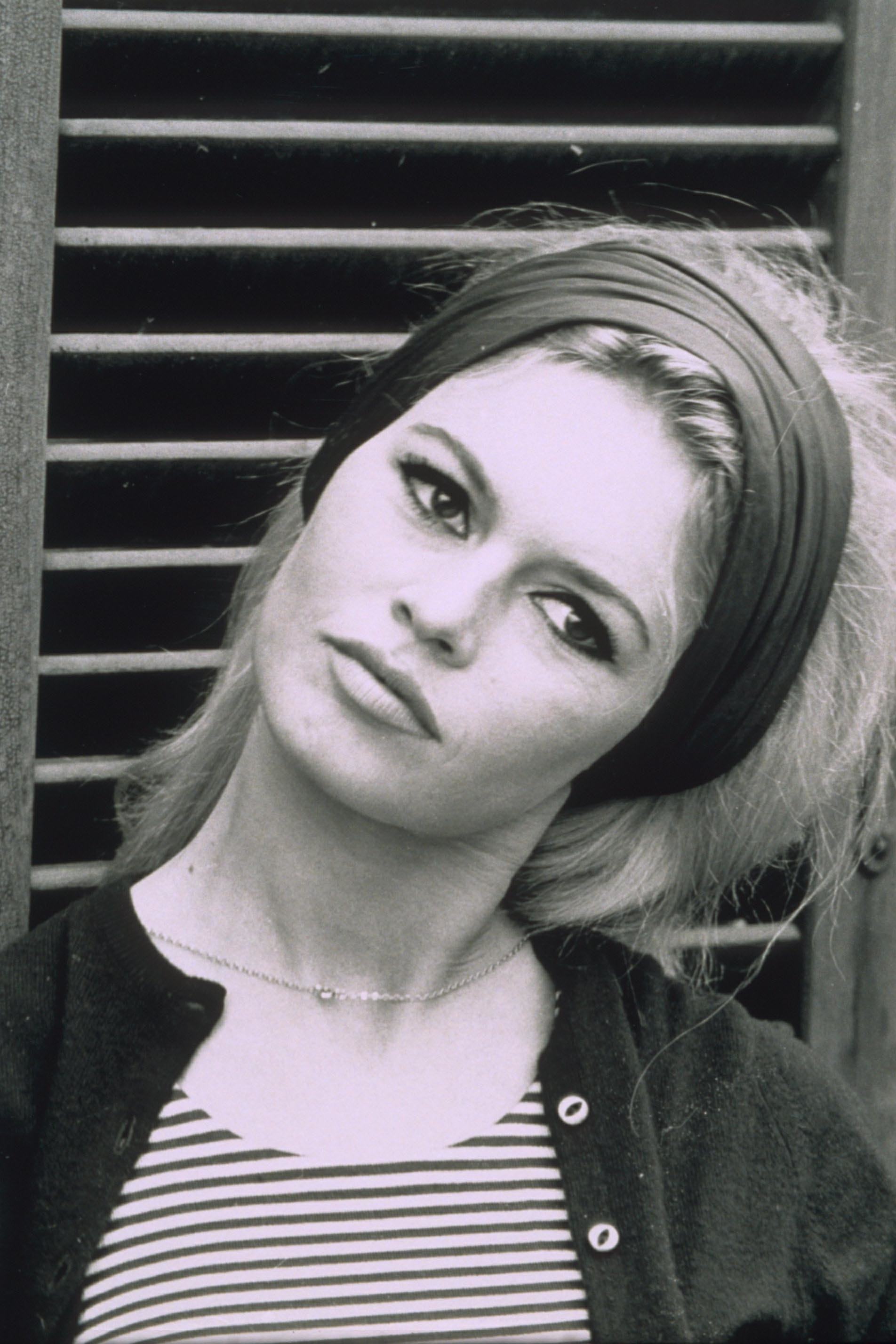 60s icon brigitte bardot with blonde hair and a wide headband