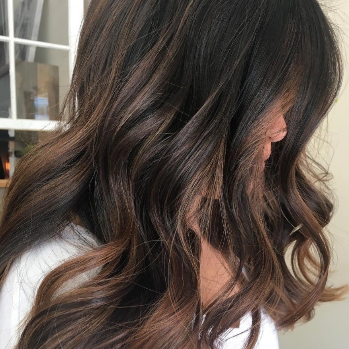 woman with coco hair colour at the salon
