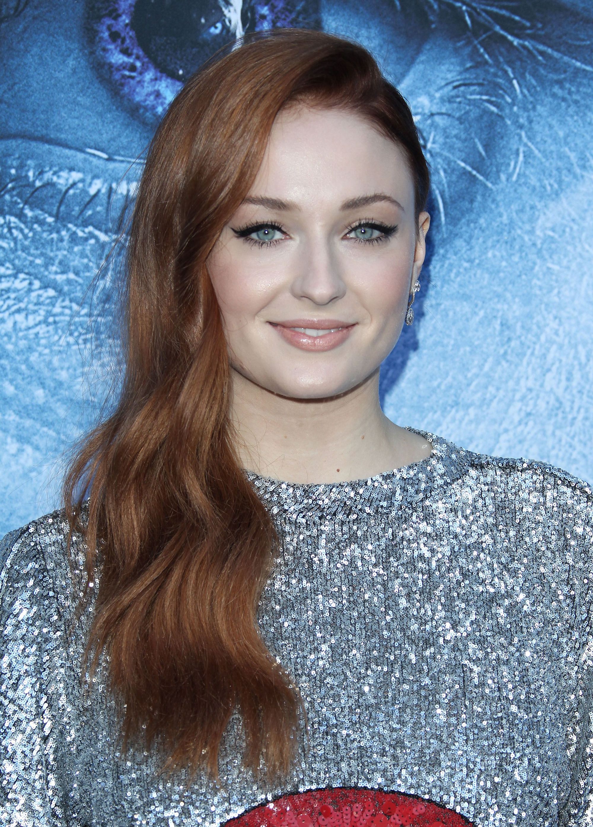 Game of Thrones Premiere - Sophie Turner with fiery dark auburn long hair in soft waves over one shoulder