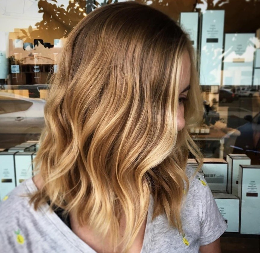 woman with honey blonde balayage hair colour at the salon