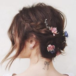 Short hair wedding updos - brunette hair with braids and flowers places throughout. Loose front section framing face