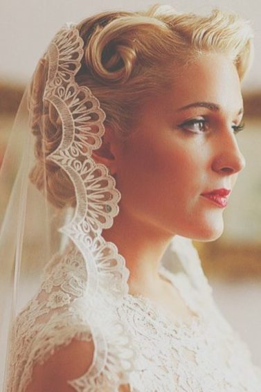 Vintage wedding hairstyles - blonde hair under a veil with retro pin curls
