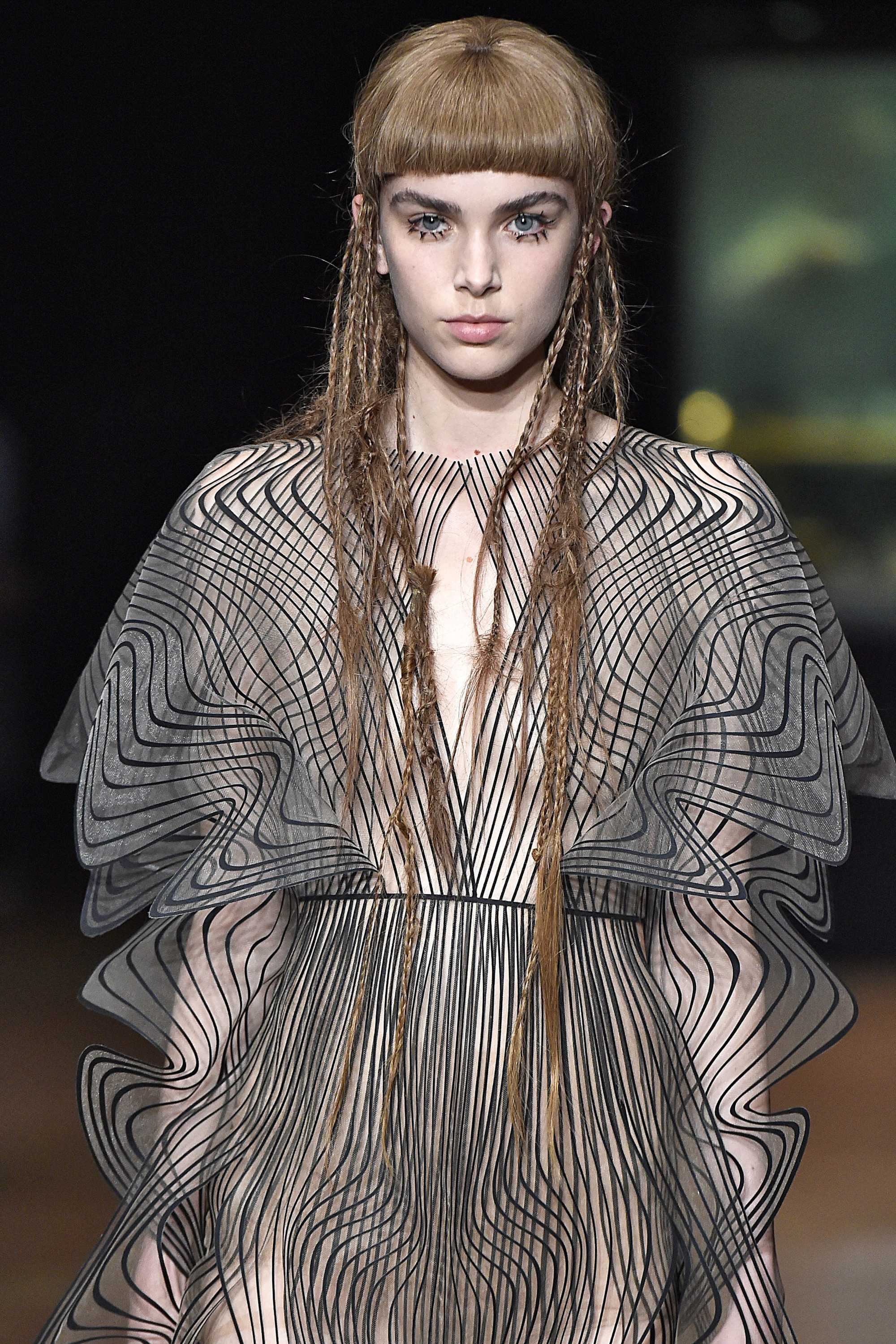 model with hidden plaits and micro bangs on the iris van herpen runway paris haute couture week