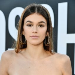 cindy crawfords daughter kaia gerber with light brunette hair in a centre parting
