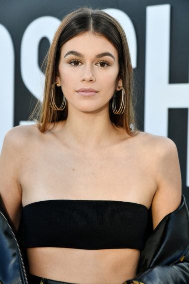 cindy crawfords daughter kaia gerber with light brunette hair in a centre parting