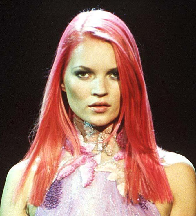Brit model Kate Moss with pink wig on the versace 1998 runway wearing a purple and gold dress