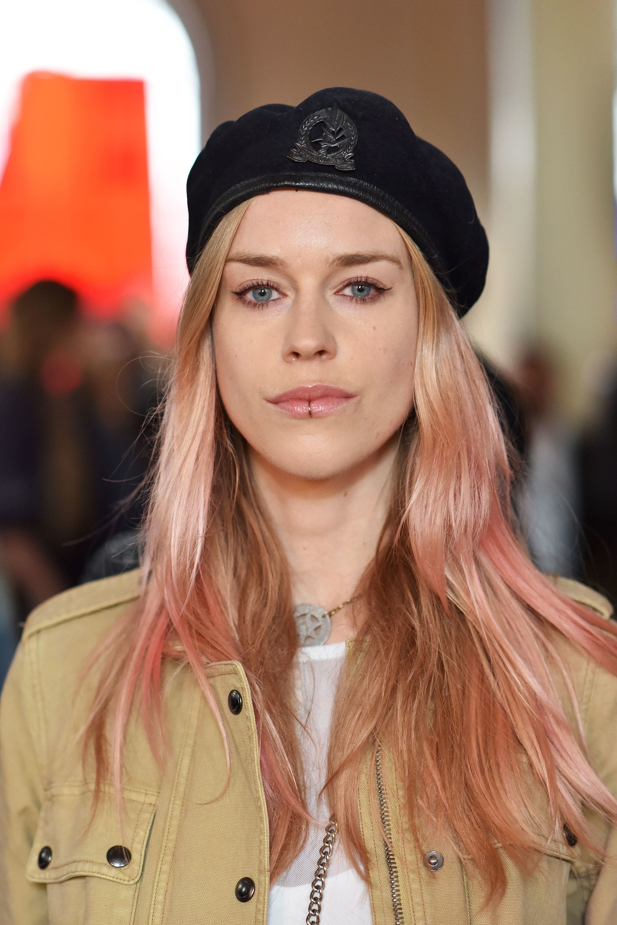 lady mary charteris with wavy pastel hair with a belstaff beret
