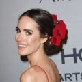 louise roe with flower updo hairstyle wearing red dress at instyle awards