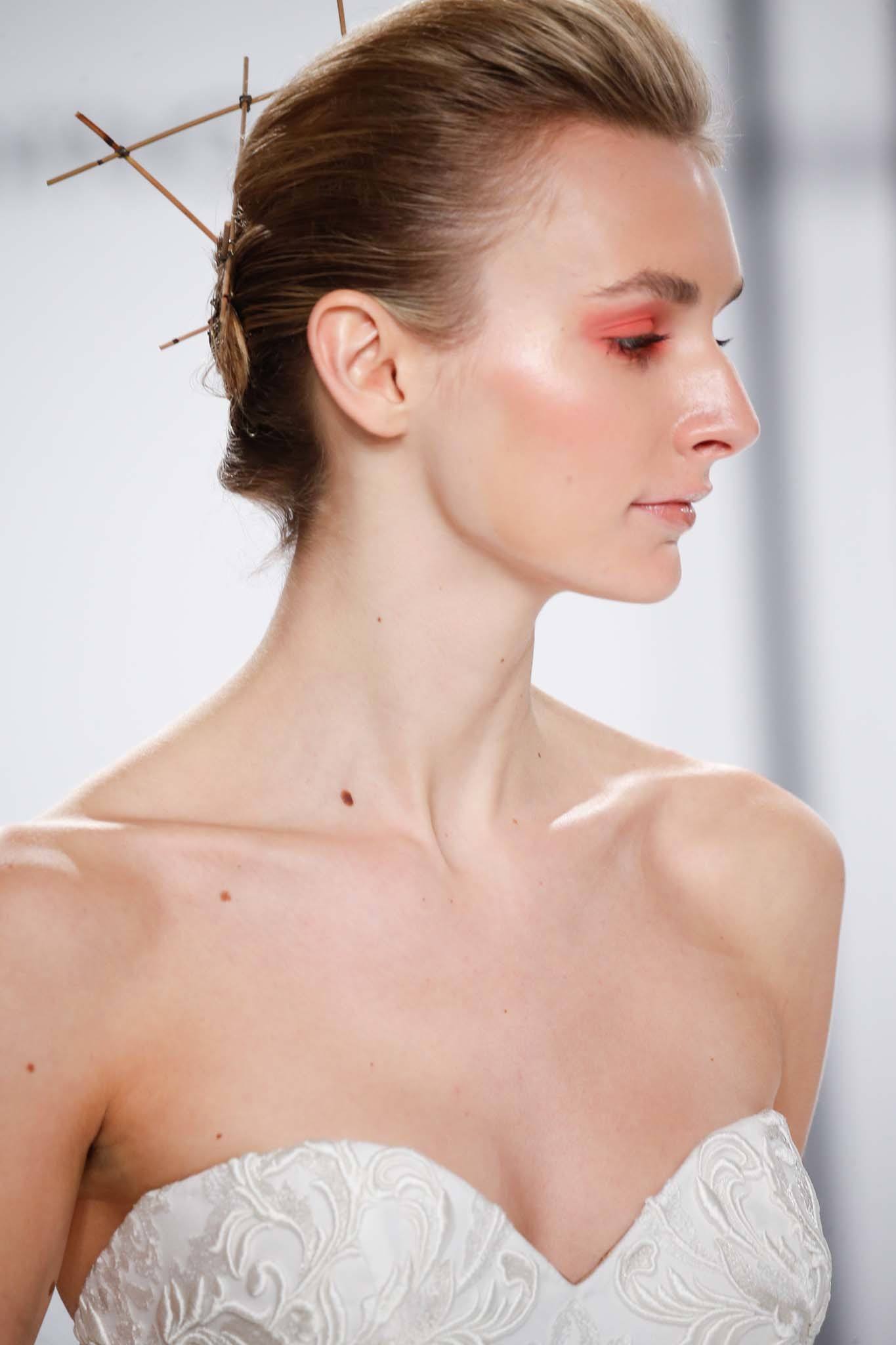 Short hair wedding updos - catwalk show model with short dark blonde hair smoothed back with accessories at the back