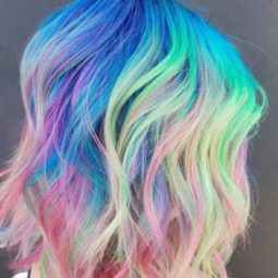 Neon rainbow hair - long bob length wavy rainbow colour hair side view