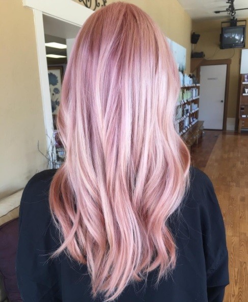 woman with long pastel pink hair