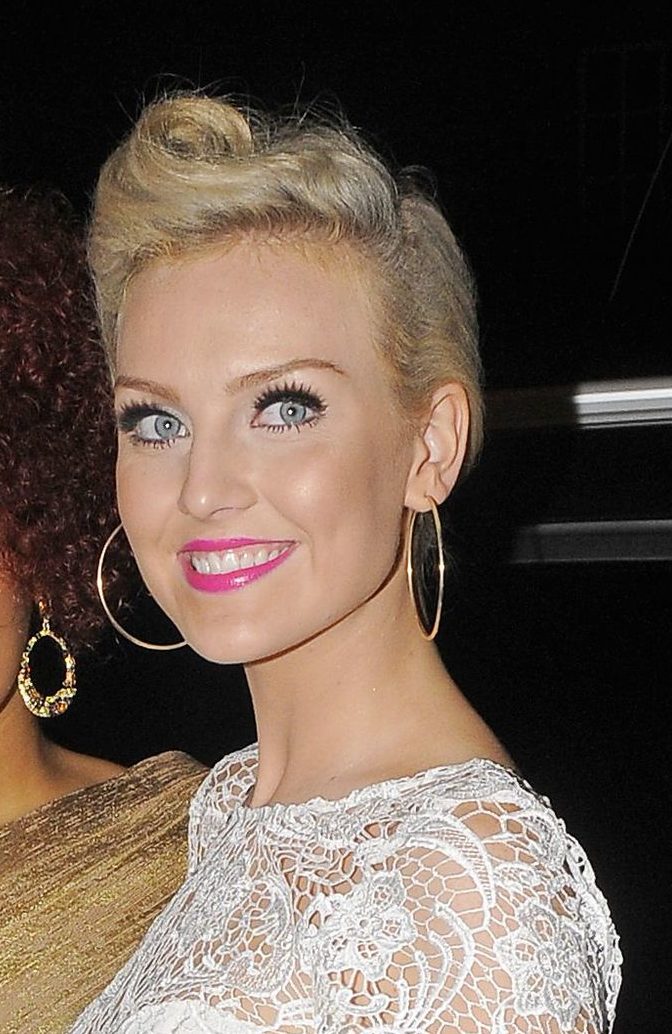 little mix star perrie edwards with her blonde hair in a victory roll hairstyle