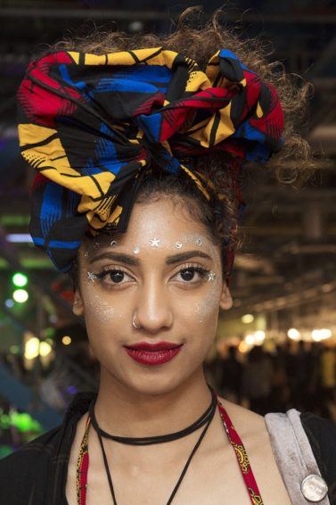 front shot of model with pineapple scarf updo at afropunk