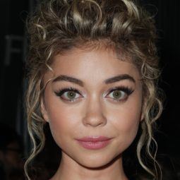 sarah hyland with blonde messy updo on the red carpet