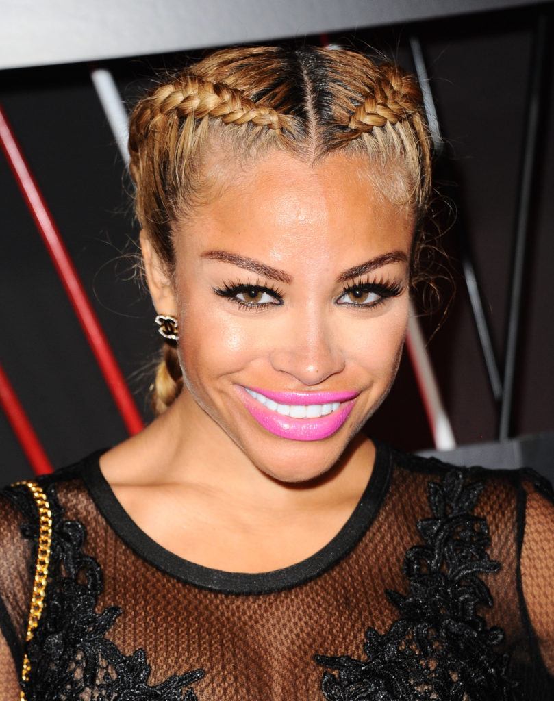 Charisse Mills with her hair dyed blonde in double dutch braid style