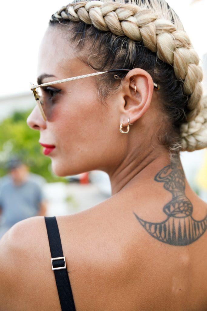 side view of a woman with blonde hair in double dutch braid style