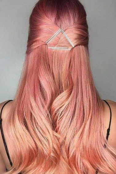 Sushi hair - long pastel peach pink hair worn in a half-up hairstyle with a geo hair accessory