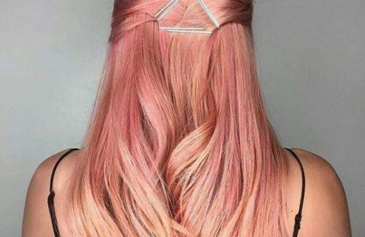 Sushi hair - long pastel peach pink hair worn in a half-up hairstyle with a geo hair accessory