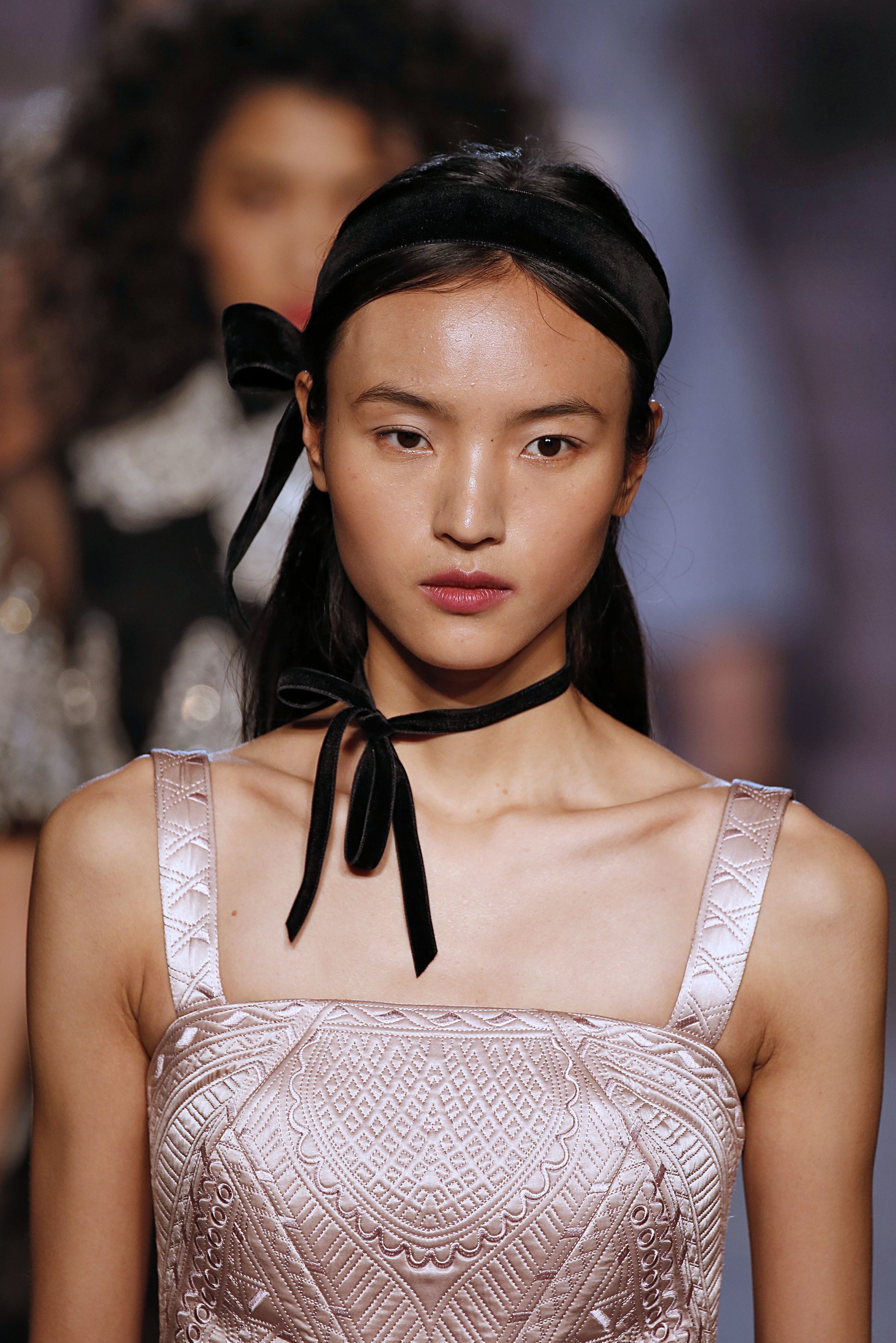 temperley model on the runway with a ribbon choker and ribbon headband detail