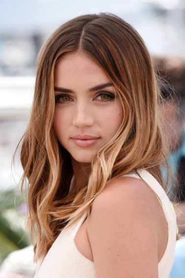 shot of ana de armas with sun kissed light brown ombre hairstyle on the red carpet