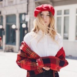 streetstyle shot of a blogger wearing a red beret