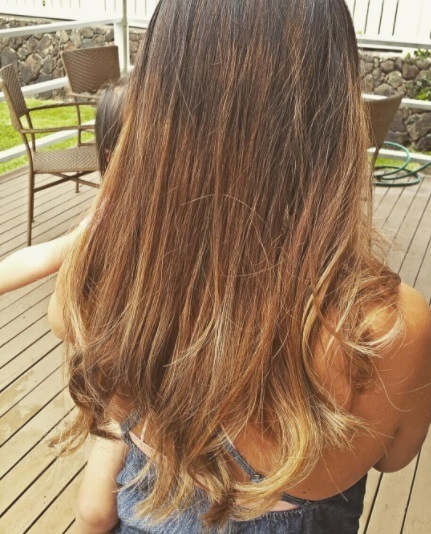 Balayage long hair: back view photo of a woman with long caramel brunette balayage hair