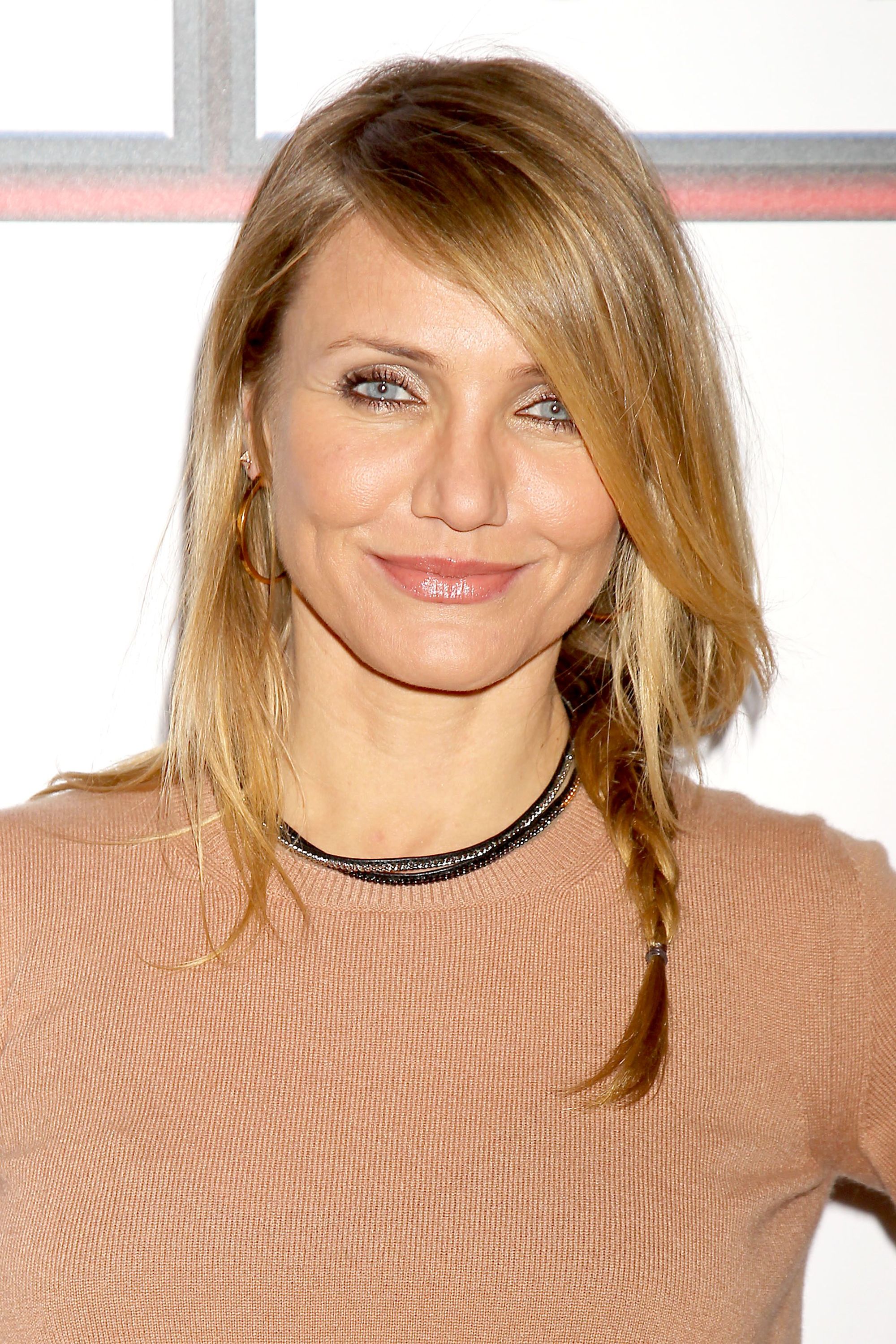 actress cameron diaz on the red carpet with her hair in a side braid with long side bangs