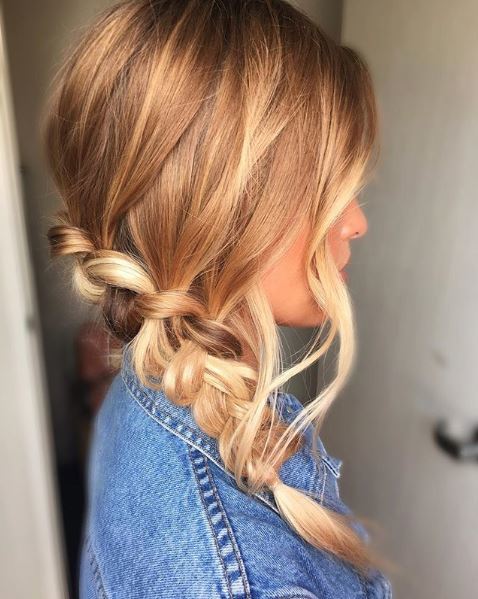 Side view of a blonde woman with a loose waterfall braid