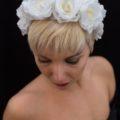 Light platinum blonde pixie cut with white floral headband