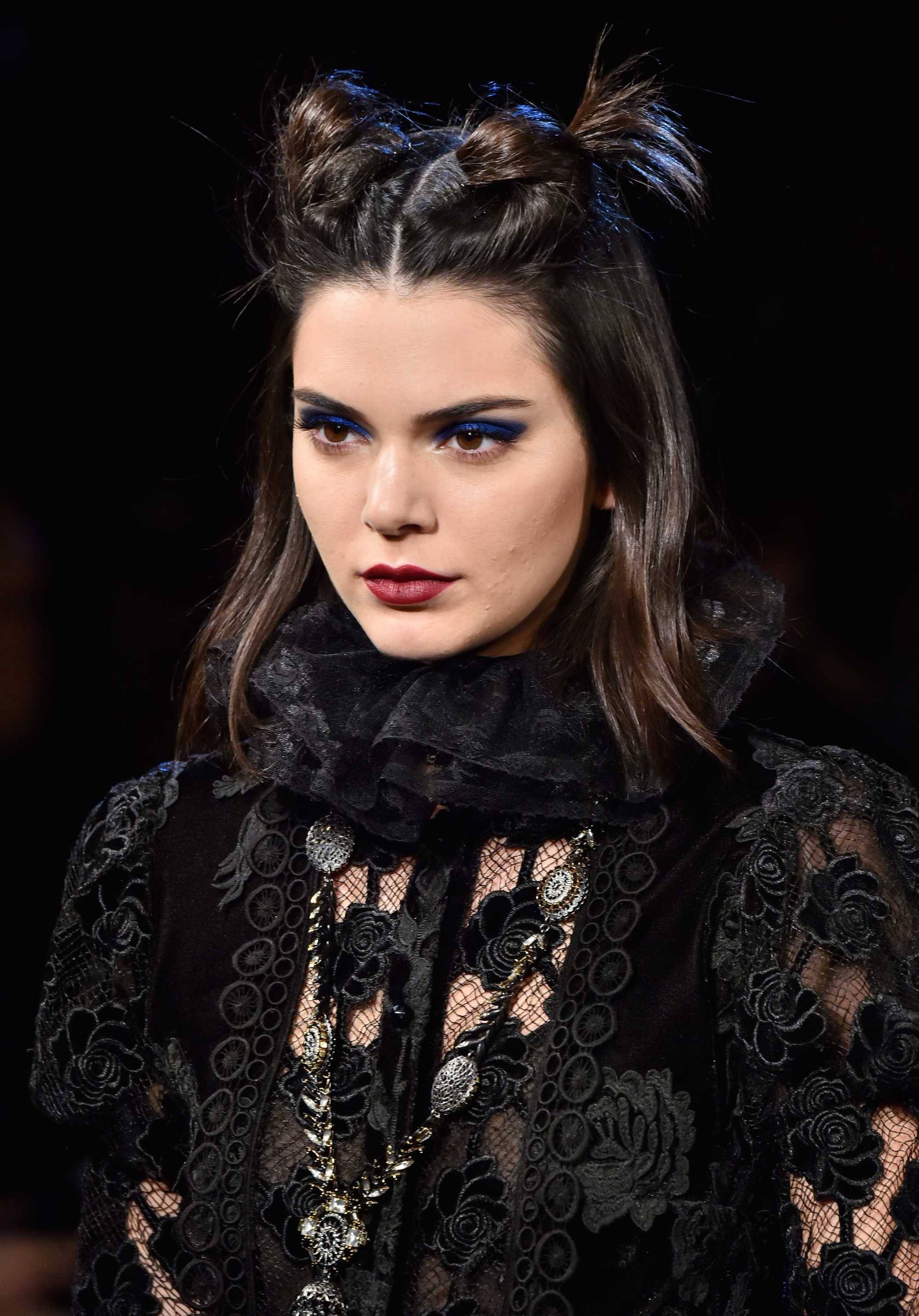 short hair hairstyles for school: Kendall Jenner with short half-up, half-down bun hairstyle on the runway wearing a/w clothing