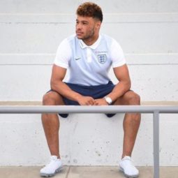 Alex Oxlade Chamberlain with brown faded hairstyle with golden brown tips wearing England football shirt