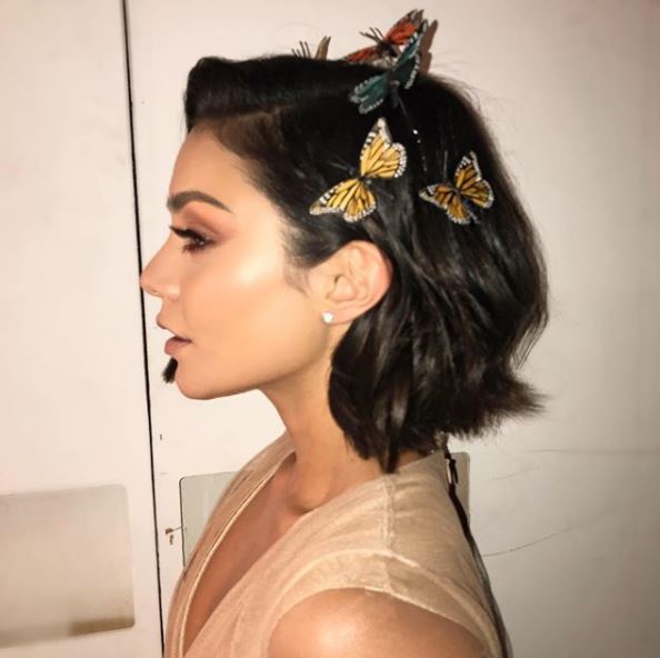 Vanessa Hudgens wears her brown hair in long bob style with golden butterfly accessories