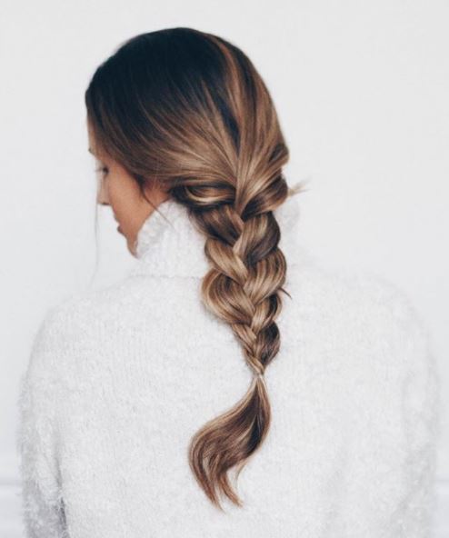 brown hair model with loose plait down back shown from behind