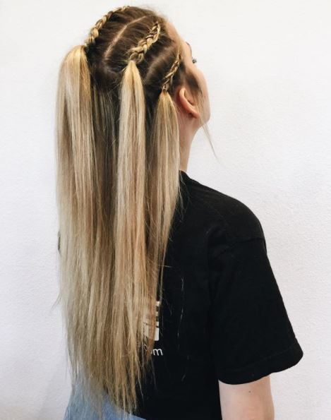 Long medium toned blonde straight hair with front section braided back shown from side view