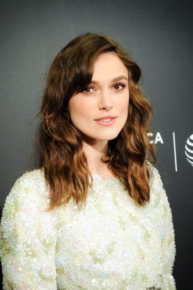 actress keira knightley with brunette tousled hair and a short side fringe