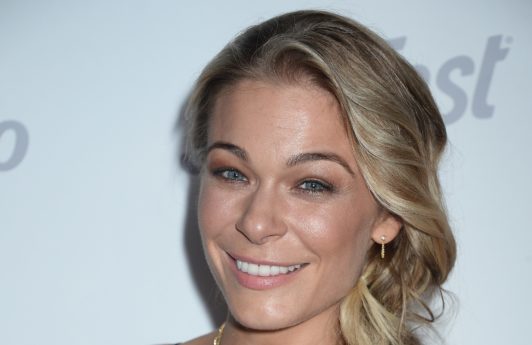 country singer leann rimes with her long blonde hair in a side braid