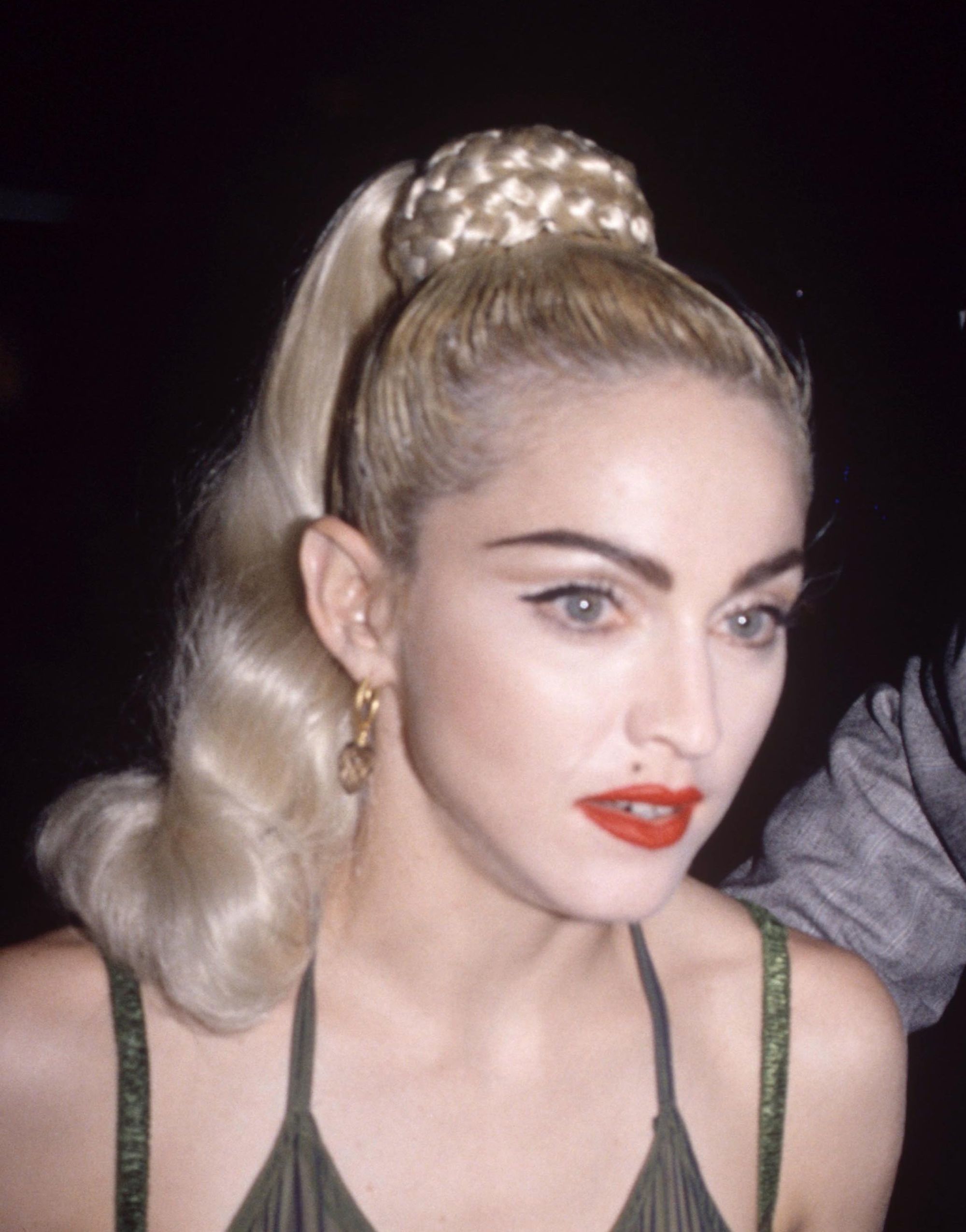 Madonna in 1990 with her iconic Blond Ambition braided high ponytail