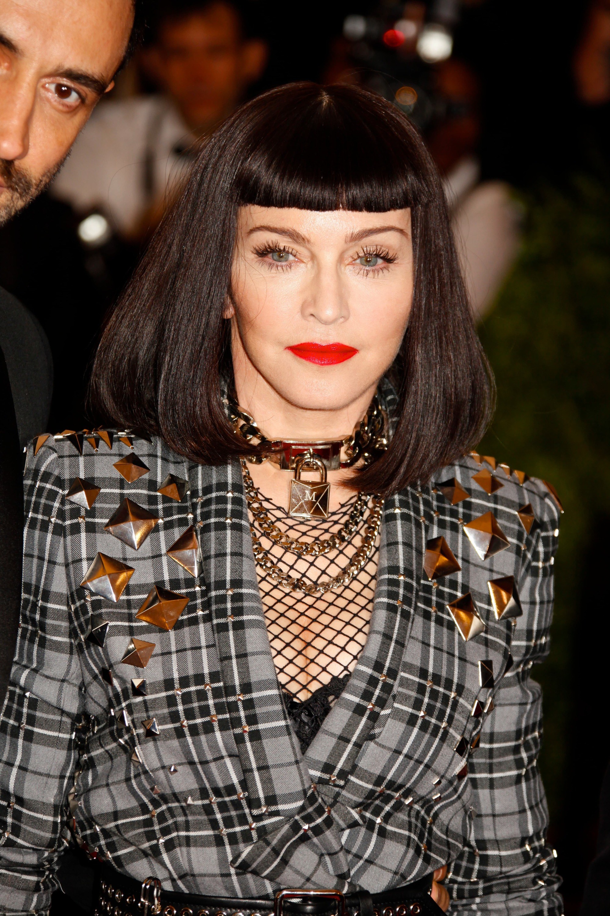 Madonna at the 2013 met ball in a dark brunette bob length wig with a blunt short fringe.