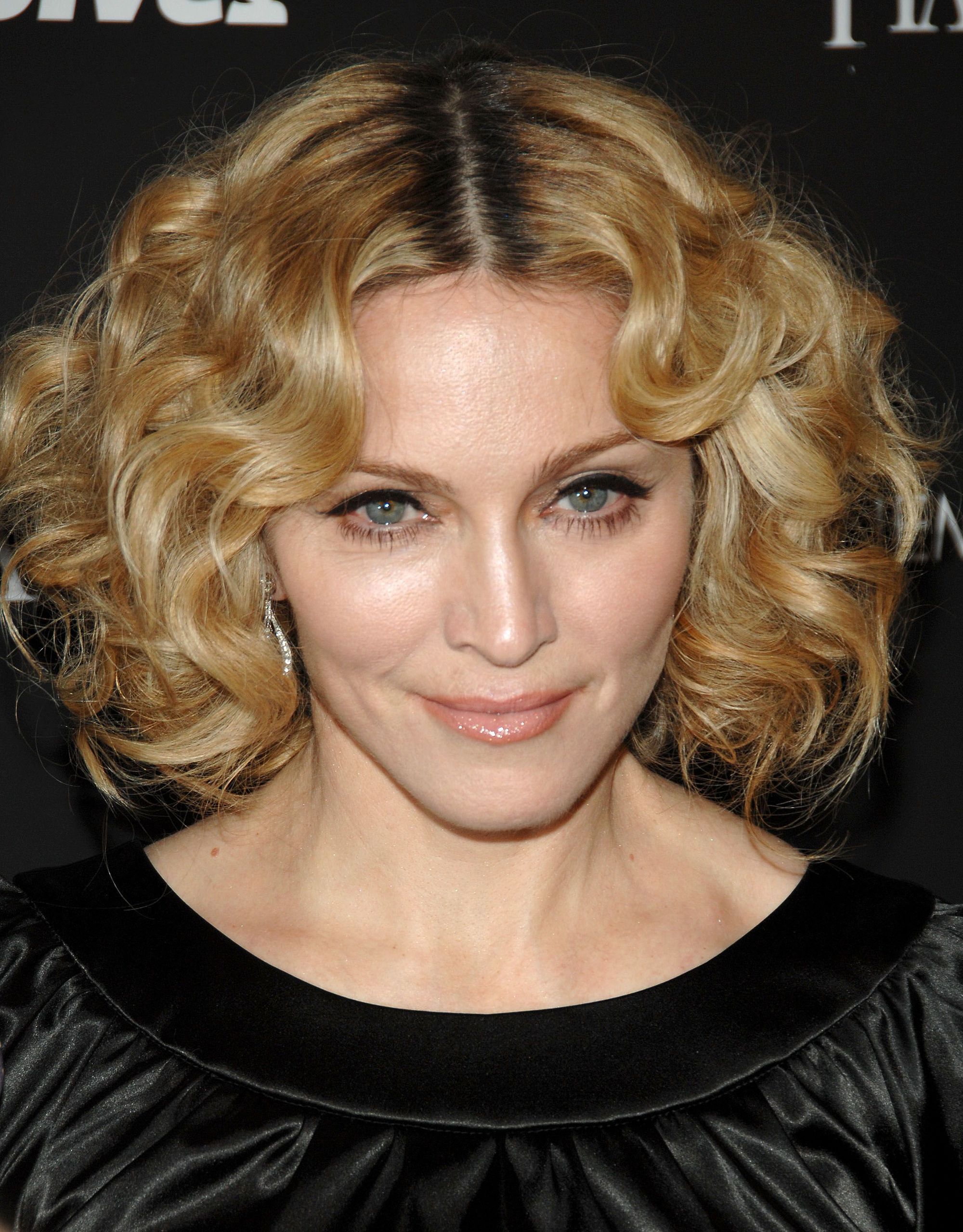 Madonna in 2007 with short curly honey blonde hair with a centre parting